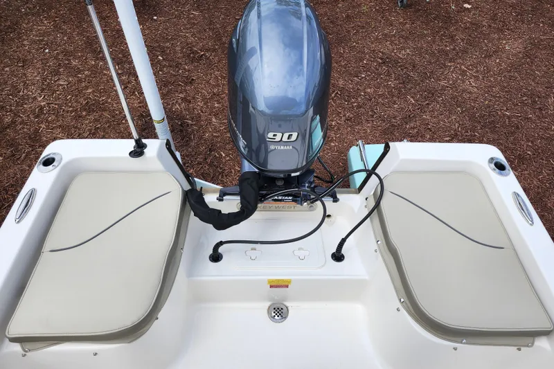 Slide: The Image of 2024 Key West 1720 Center Console boat with Yamaha 90 engine, rear seating view. - 33