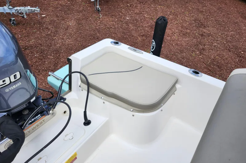 Slide: The Image of 2024 Key West 1720 Center Console boat with Yamaha 90 engine, rear seating area. - 34