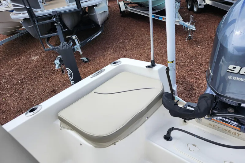 Slide: The Image of 2024 Key West 1720 Center Console boat with Yamaha 90 engine, docked on mulch. - 35