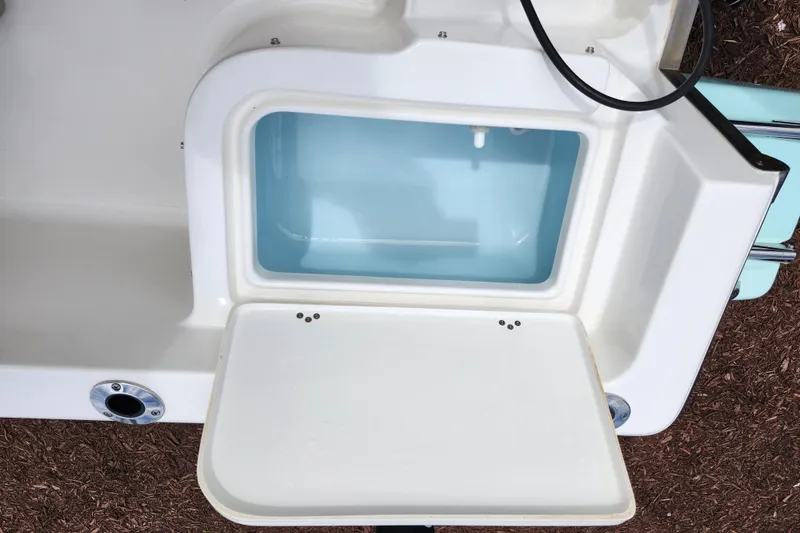 Slide: The Image of 2024 Key West 1720 Center Console boat livewell with open lid, showcasing interior. - 37