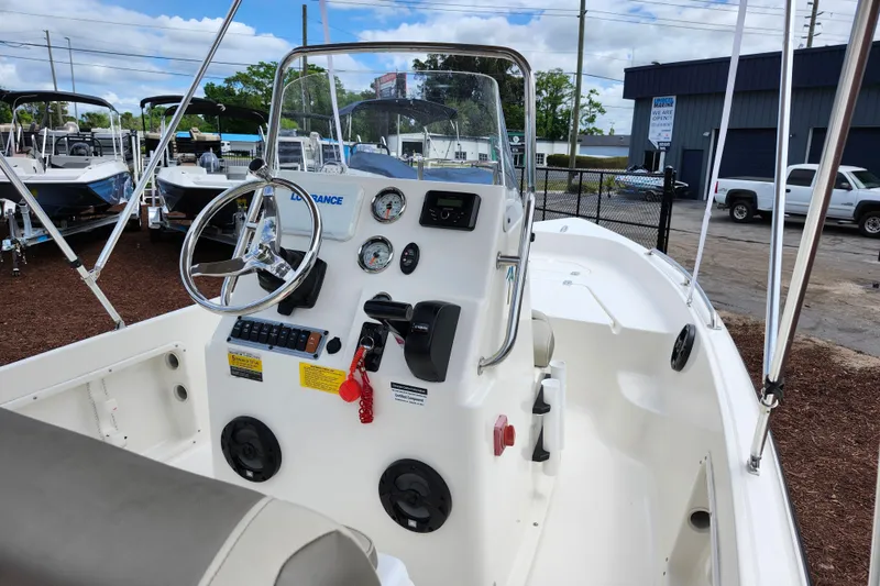Slide: The Image of 2024 Key West 1720 Center Console boat interior with steering wheel and control panel. - 39
