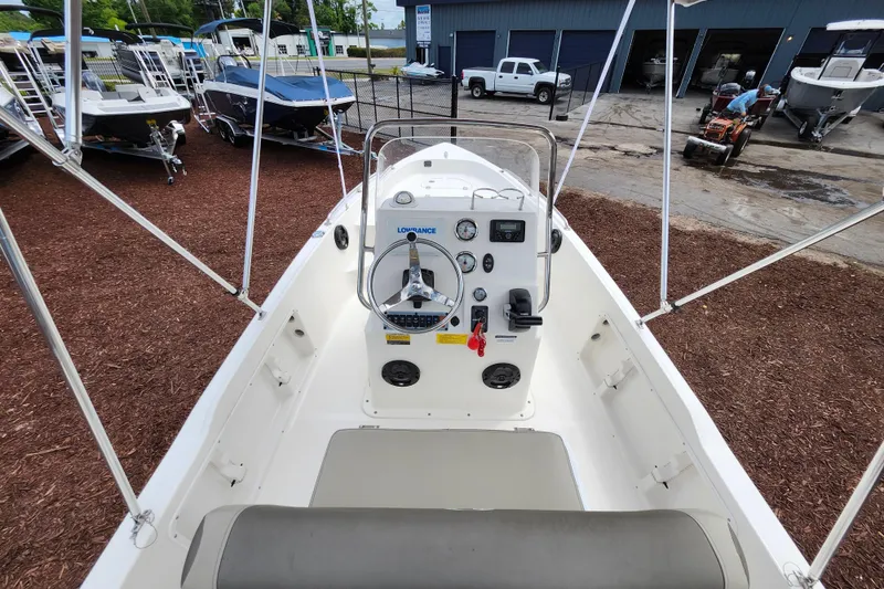 Slide: The Image of 2024 Key West 1720 Center Console boat interior with steering wheel and controls. - 40