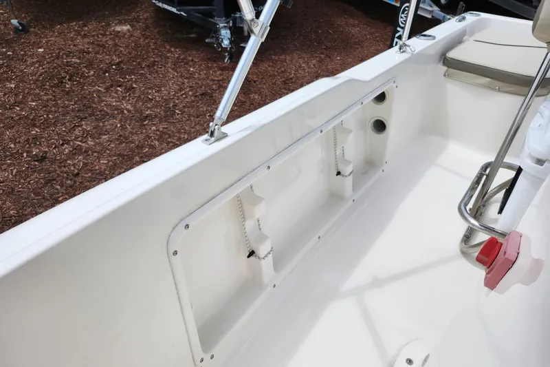 Slide: The Image of 2024 Key West 1720 Center Console boat interior, featuring rod holders and seating area. - 41