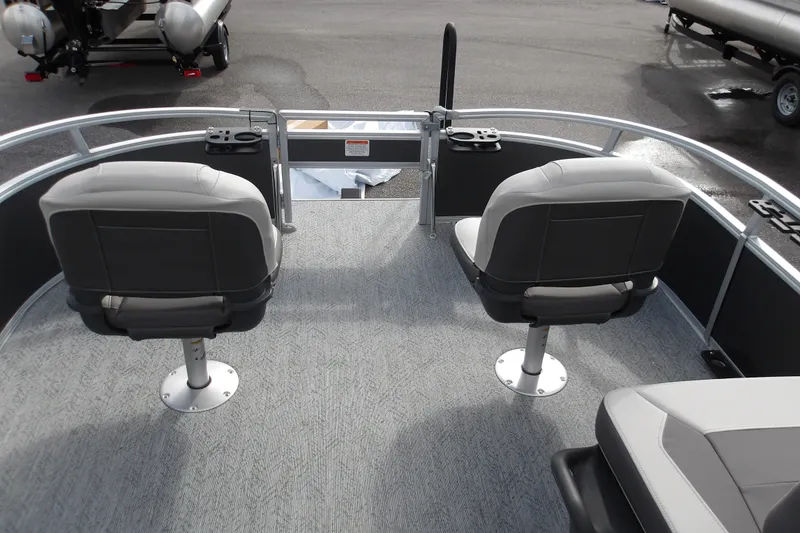 Slide: The Image of 2026 Sun Tracker Bass Buggy 16 XL Select pontoon boat interior with swivel seats. - 15