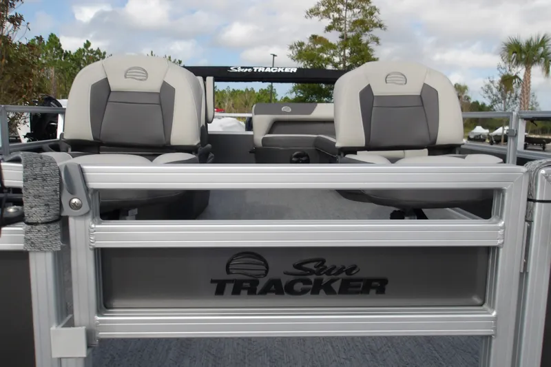 Slide: The Image of 2026 Sun Tracker Bass Buggy 16 XL Select pontoon boat with comfortable seating and sleek design. - 16