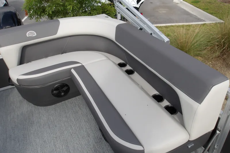 Slide: The Image of 2026 Sun Tracker Bass Buggy 16 XL Select pontoon boat seating with cup holders and speaker. - 14