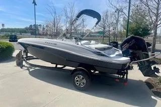 Slide: The Image of 2026 Tahoe T18 boat on trailer, parked outdoors, sunny day. - 3