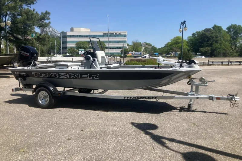 Slide: The Image of 2026 Tracker Bass Tracker Classic CC boat on trailer in parking lot. - 7
