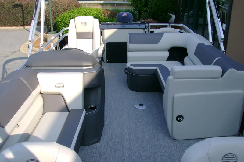 Slide: The Image of 2026 Sun Tracker Fishin' Barge 20 DLX interior with spacious seating and modern design. - 5