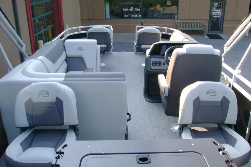 Slide: The Image of 2026 Sun Tracker Fishin' Barge 20 DLX interior with comfortable seating and modern design. - 6