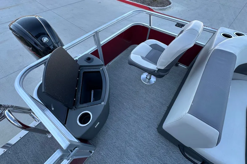 Slide: The Image of 2026 Sun Tracker Bass Buggy 18 DLX interior with seating and storage compartments. - 18