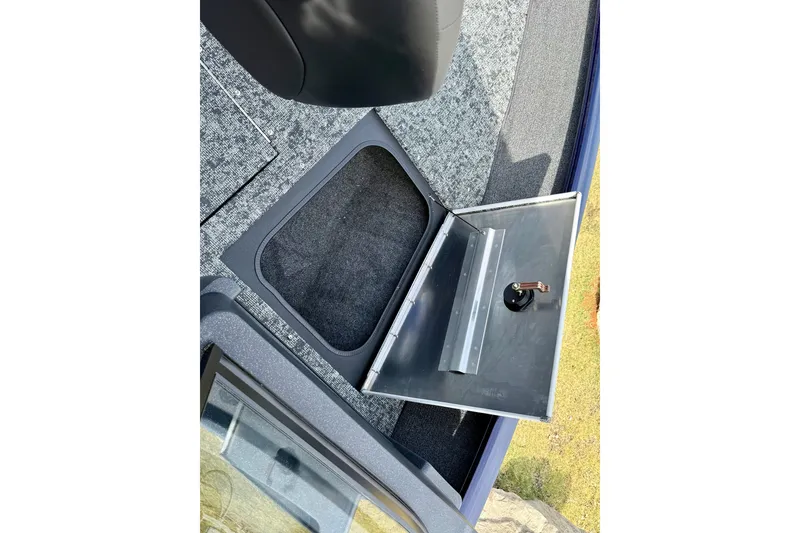 Slide: The Image of 2026 Tracker Pro Guide V-175 WT boat storage compartment with open hatch. - 22