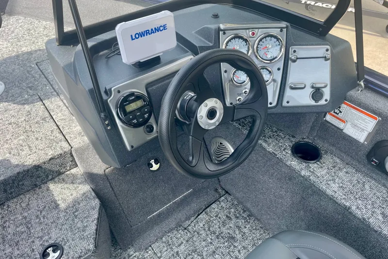 Slide: The Image of 2026 Tracker Pro Guide V-175 WT boat dashboard with steering wheel and Lowrance display. - 20