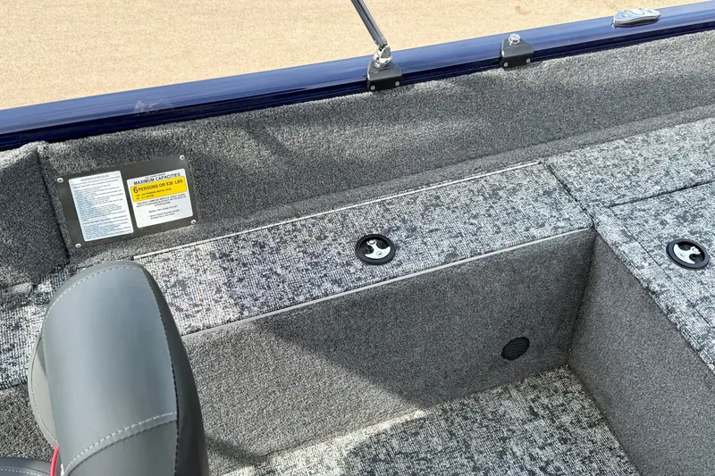 Slide: The Image of 2026 Tracker Pro Guide V-175 WT boat interior with gray carpet and seating. - 18