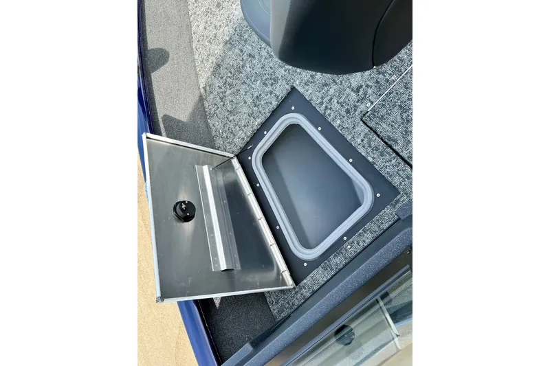 Slide: The Image of Open storage compartment on 2026 Tracker Pro Guide V-175 WT boat deck. - 21