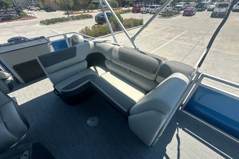 Slide: The Image of 2026 Sun Tracker Fishin' Barge 20 DLX interior seating, showcasing spacious and comfortable design. - 17