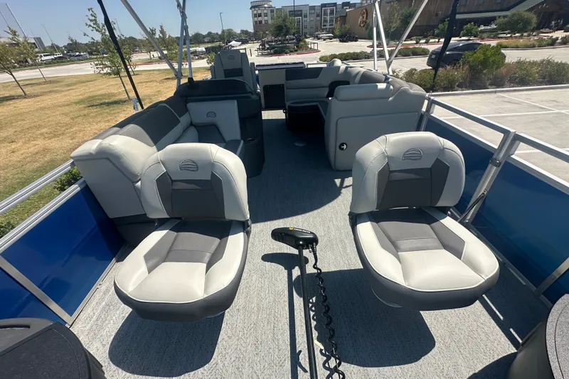 Slide: The Image of 2026 Sun Tracker Fishin' Barge 20 DLX interior with comfortable seating and modern design. - 15