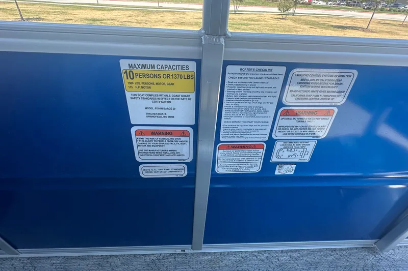 Slide: The Image of Safety and capacity labels on 2026 Sun Tracker Fishin' Barge 20 DLX boat. - 27