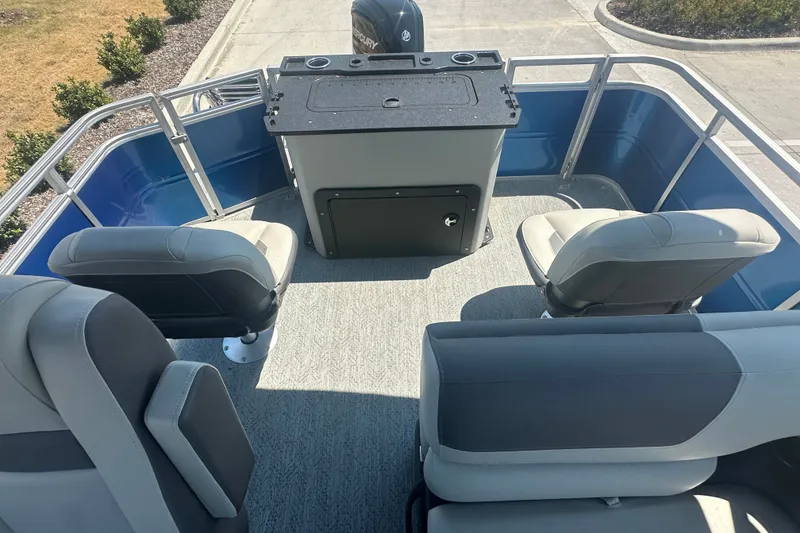 Slide: The Image of 2026 Sun Tracker Fishin' Barge 20 DLX interior with seating and helm station. - 19