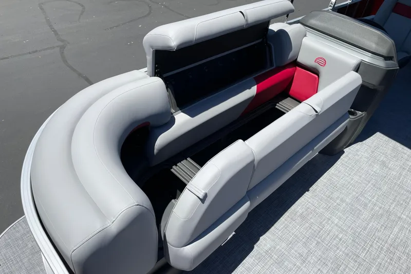Slide: The Image of 2026 Sun Tracker Party Barge 20 DLX interior seating with storage compartments. - 7