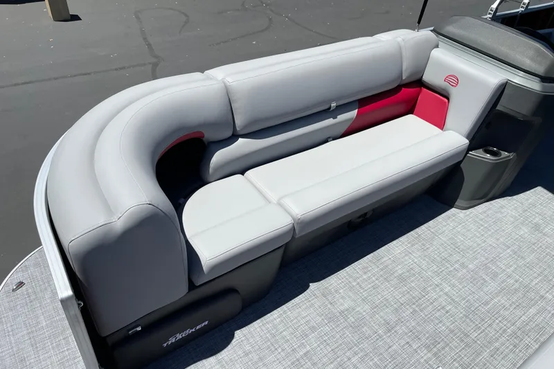 Slide: The Image of 2026 Sun Tracker Party Barge 20 DLX pontoon boat seating, featuring gray and red upholstery. - 5
