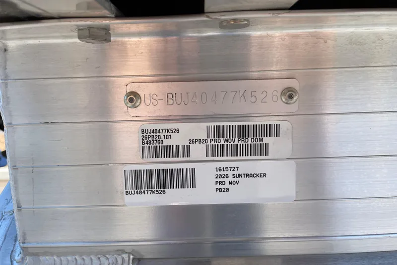 Slide: The Image of 2026 Sun Tracker Party Barge 20 DLX identification plate with serial numbers and barcodes. - 91