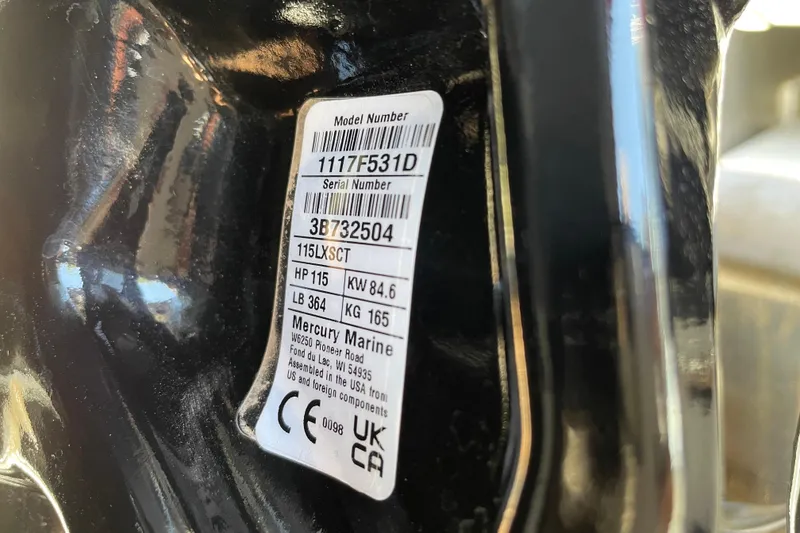 Slide: The Image of Label on Mercury Marine engine, showing model and serial numbers, horsepower, and weight details. - 93