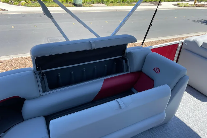 Slide: The Image of 2026 Sun Tracker Party Barge 20 DLX with open storage compartment on deck. - 12