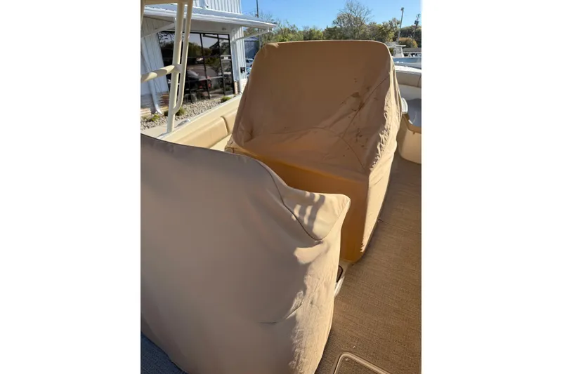 Slide: The Image of 2015 Chris-Craft 291 Catalina boat with protective covers on deck. - 15