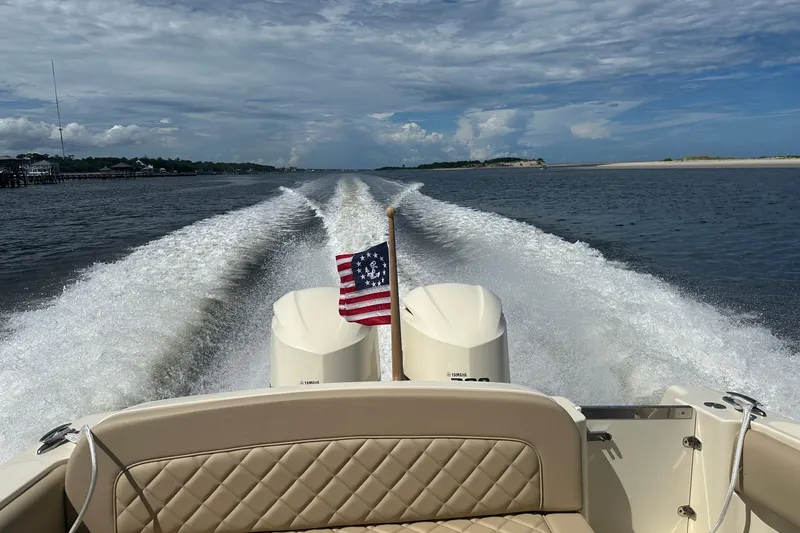 Slide: The Image of 2015 Chris-Craft 291 Catalina cruising on open water, leaving a wake behind. - 18
