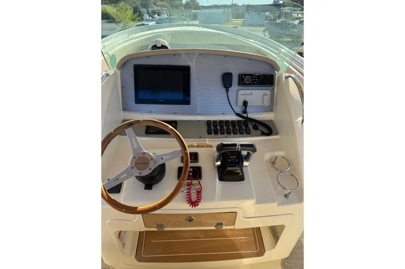 Slide: The Image of Helm of 2015 Chris-Craft 291 Catalina with steering wheel and navigation controls. - 3