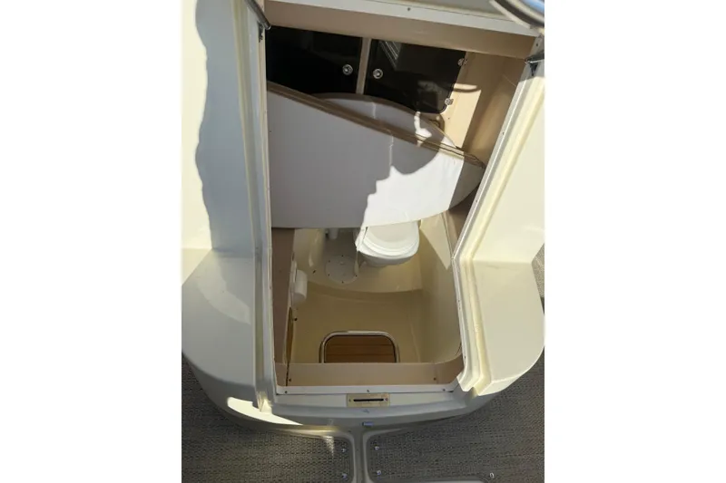 Slide: The Image of 2015 Chris-Craft 291 Catalina boat interior with open hatch and visible toilet. - 5
