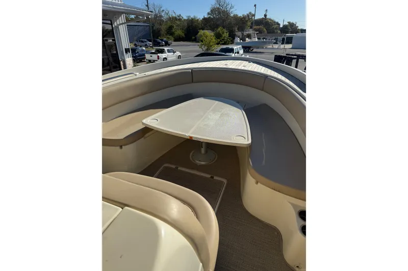 Slide: The Image of 2015 Chris-Craft 291 Catalina boat interior with seating and table setup. - 7