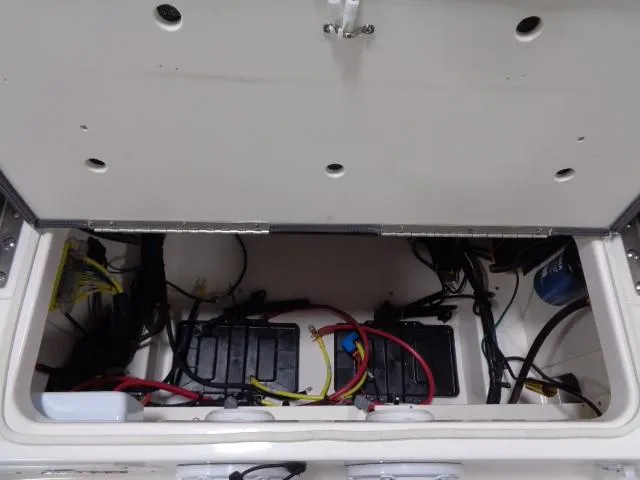 Slide: The Image of Battery compartment of 2023 Robalo 246 Cayman boat model. - 10