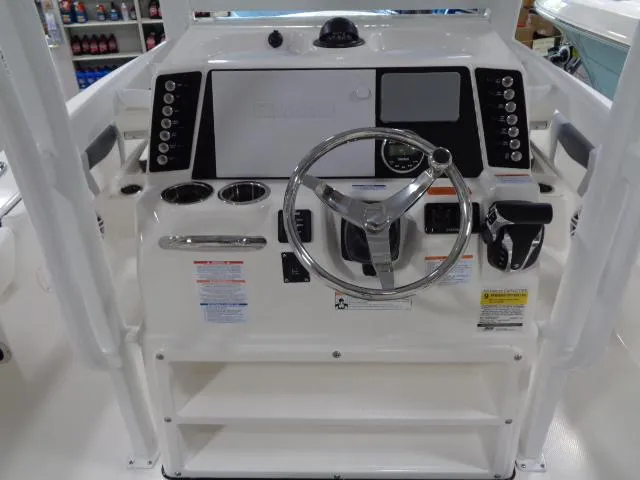 Slide: The Image of Control console of the 2023 Robalo 246 Cayman boat model. - 12