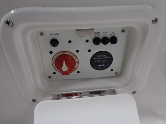 Slide: The Image of Control panel of 2023 Robalo 246 Cayman with switches and dial. - 13