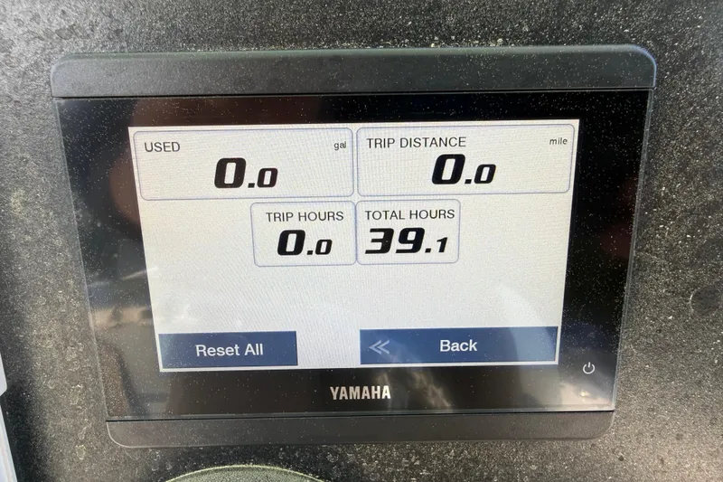 Slide: The Image of Yamaha display on 2023 Robalo 246 Cayman showing trip and total hours. - 16