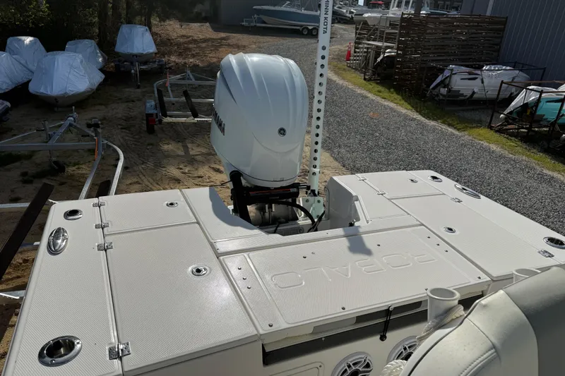 Slide: The Image of 2023 Robalo 246 Cayman boat with Yamaha outboard motor, parked on a trailer. - 17