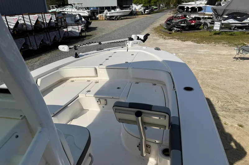 Slide: The Image of 2023 Robalo 246 Cayman boat interior, showcasing spacious deck and seating area. - 18