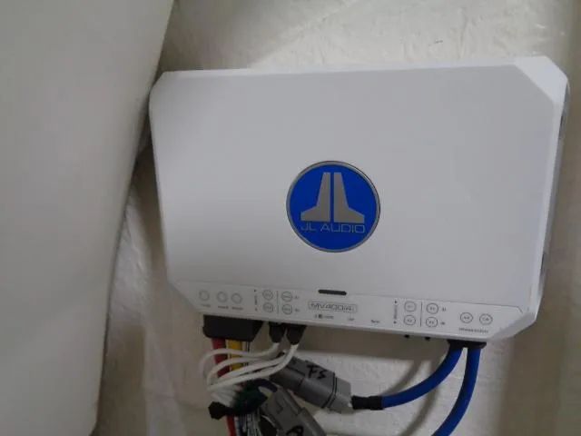 Slide: The Image of JL Audio amplifier in a 2023 Robalo 246 Cayman boat. - 7