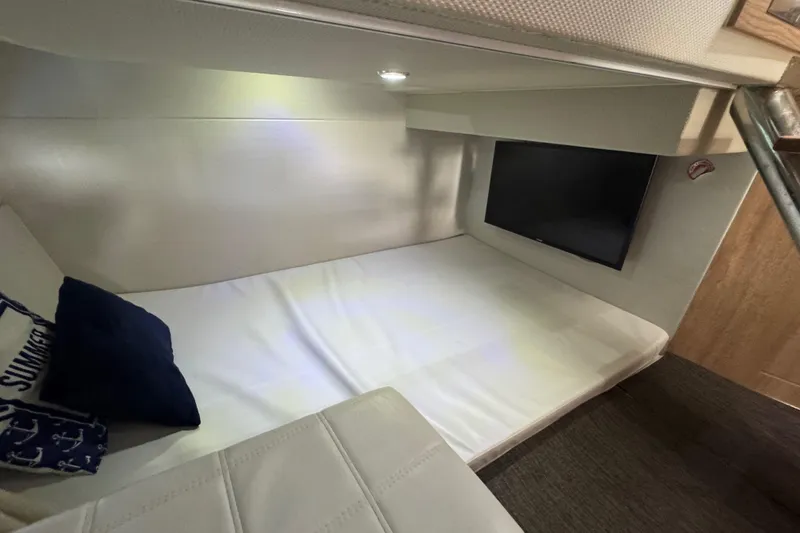 Slide: The Image of Cozy cabin interior of 2020 Evolve 360HT with bed and TV. - 17