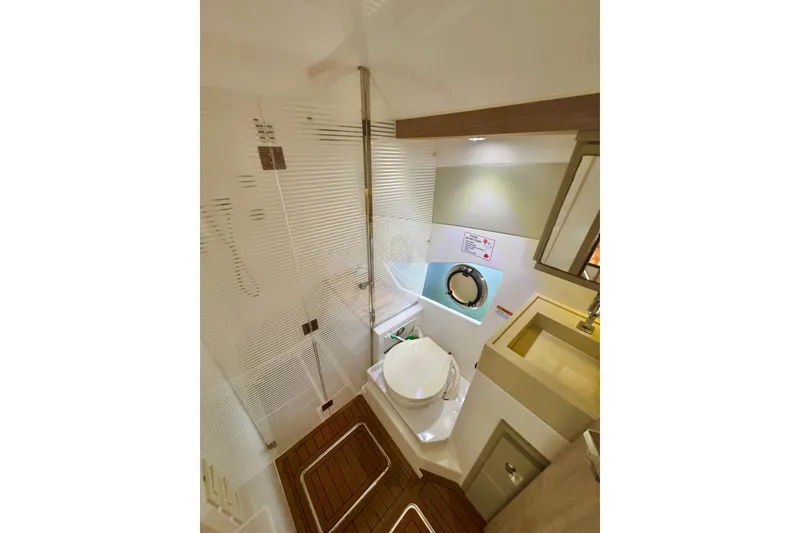 Slide: The Image of Modern bathroom interior in 2020 Evolve 360HT yacht, featuring sleek design and compact amenities. - 19