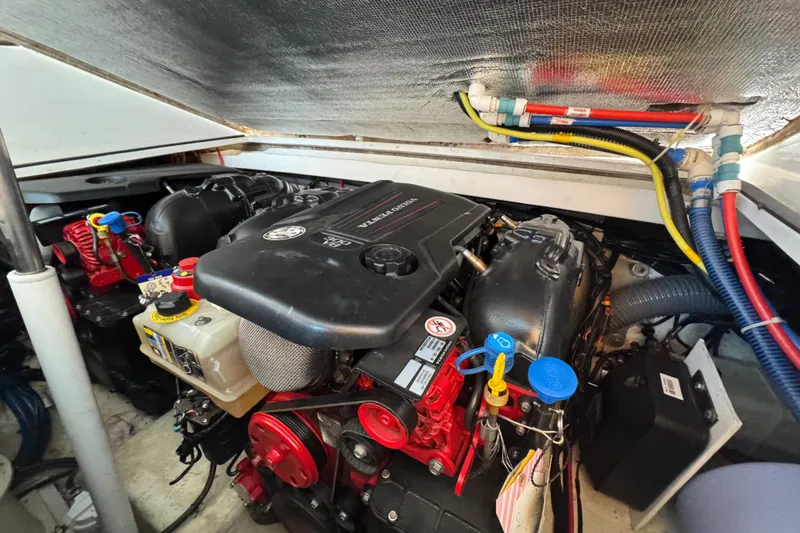 Slide: The Image of Engine compartment of a 2020 Evolve 360HT boat, showcasing detailed mechanical components. - 22