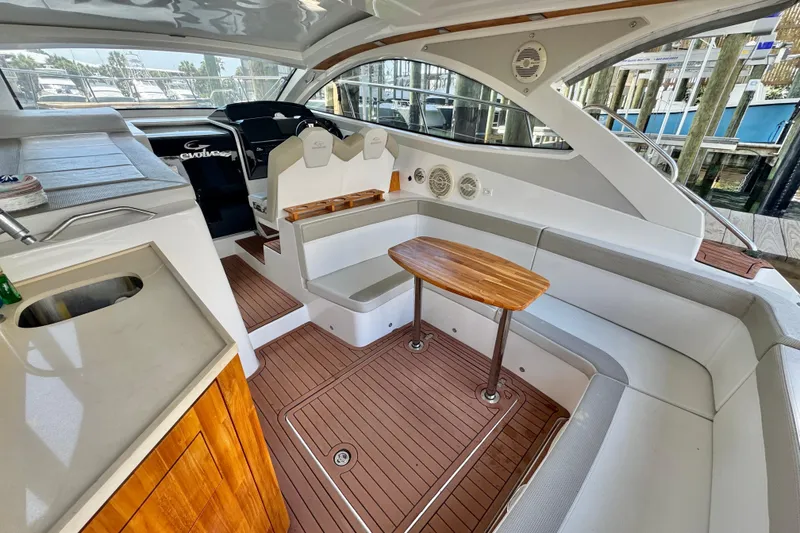 Slide: The Image of Luxurious interior of 2020 Evolve 360HT yacht with elegant seating and wooden table. - 5