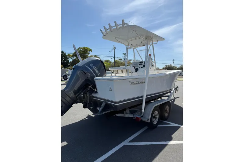 Slide: The Image of 2004 Regulator 21 Forward Seating boat on trailer with Yamaha outboard motor. - 8