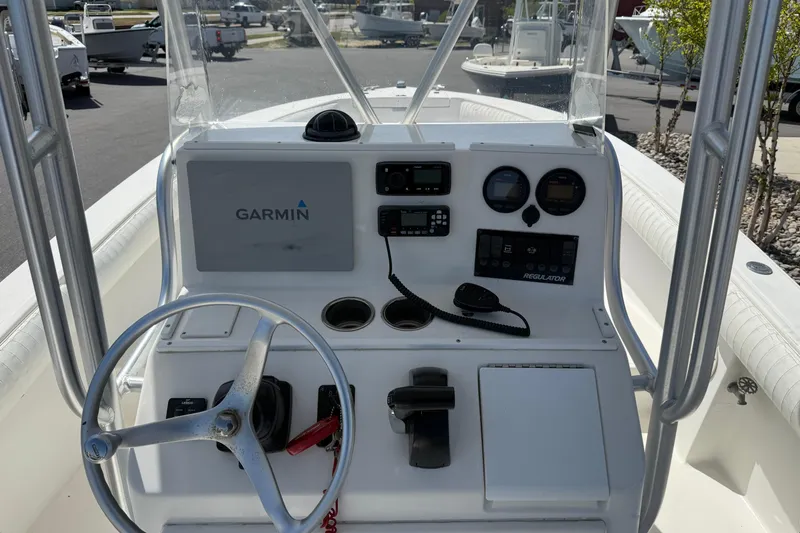 Slide: The Image of 2004 Regulator 21 Forward Seating boat console with Garmin navigation system and controls. - 9