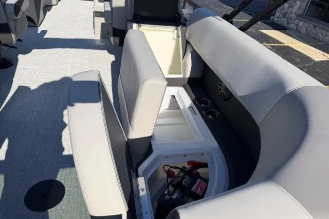 Slide: The Image of Interior view of 2026 Alera A22Q boat with open storage compartments. - 10