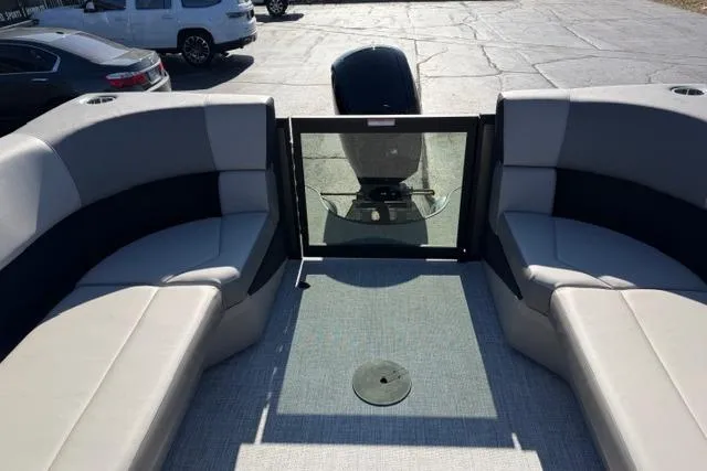 Slide: The Image of Alera A22Q 2026 boat interior with gray seating and open deck view. - 13