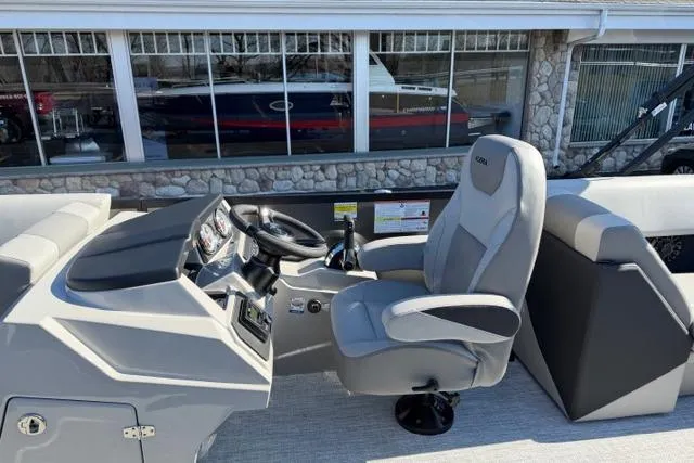 Slide: The Image of Modern Alera A22Q boat interior with sleek captain's chair and control panel, 2026 model. - 16