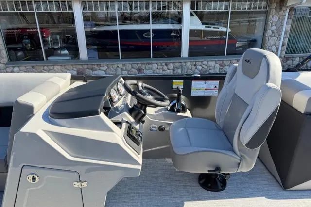 Slide: The Image of Alera A22Q 2026 boat cockpit with steering wheel and captain's chair. - 17